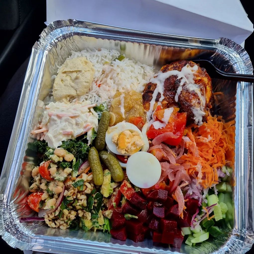 Gym Cafe mixed protein box with grilled chicken, rice, salads and eggs